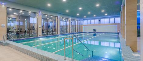 Indoor pool, seasonal outdoor pool, pool umbrellas, pool loungers