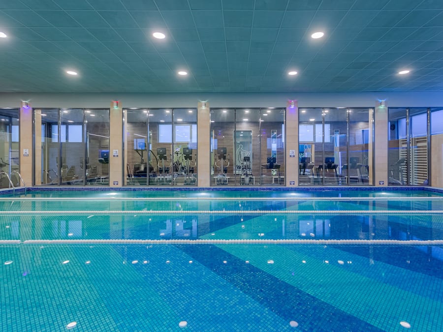 Indoor pool, seasonal outdoor pool, pool umbrellas, pool loungers