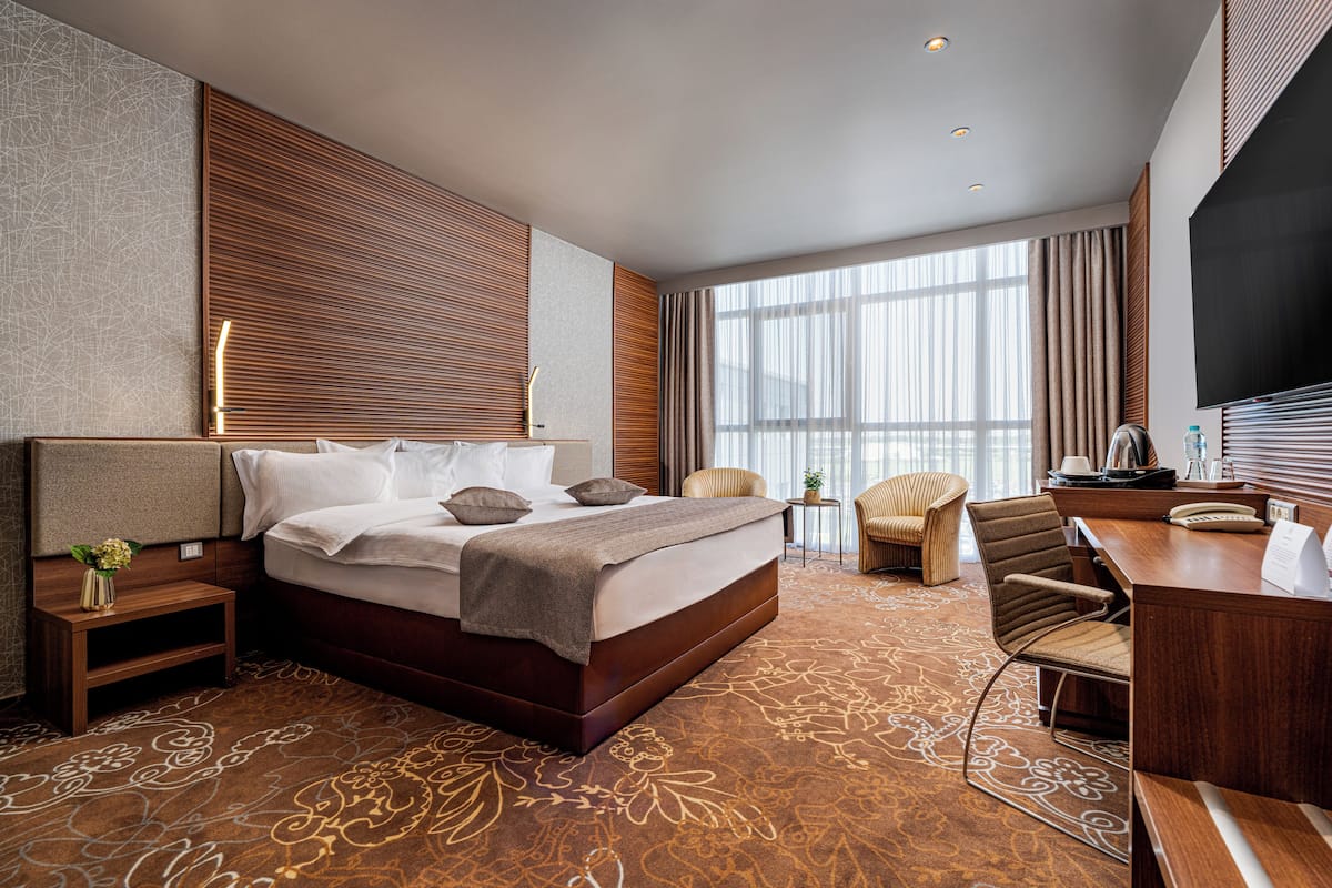 Habitación ejecutiva, 1 cama King size | Minibar, caja de seguridad en la habitación y escritorio