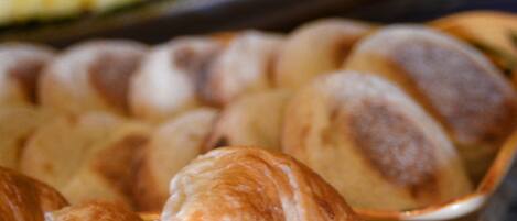 A tray of freshly baked bread rolls.