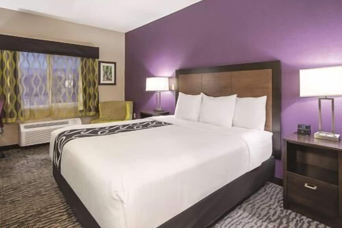 Premium bedding, desk, laptop workspace, blackout curtains