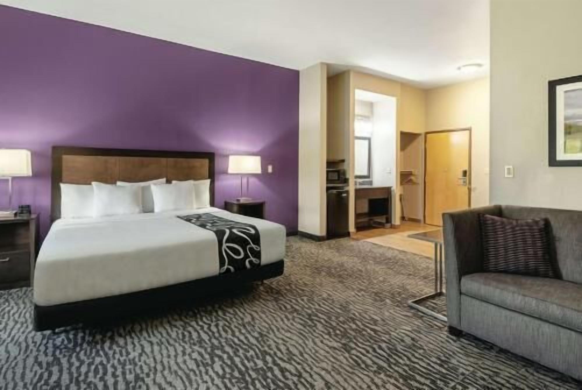 Premium bedding, desk, laptop workspace, blackout drapes