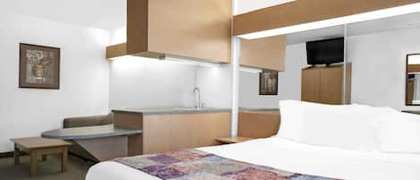 Suite, 1 Queen Bed | Desk, laptop workspace, blackout drapes, iron/ironing board