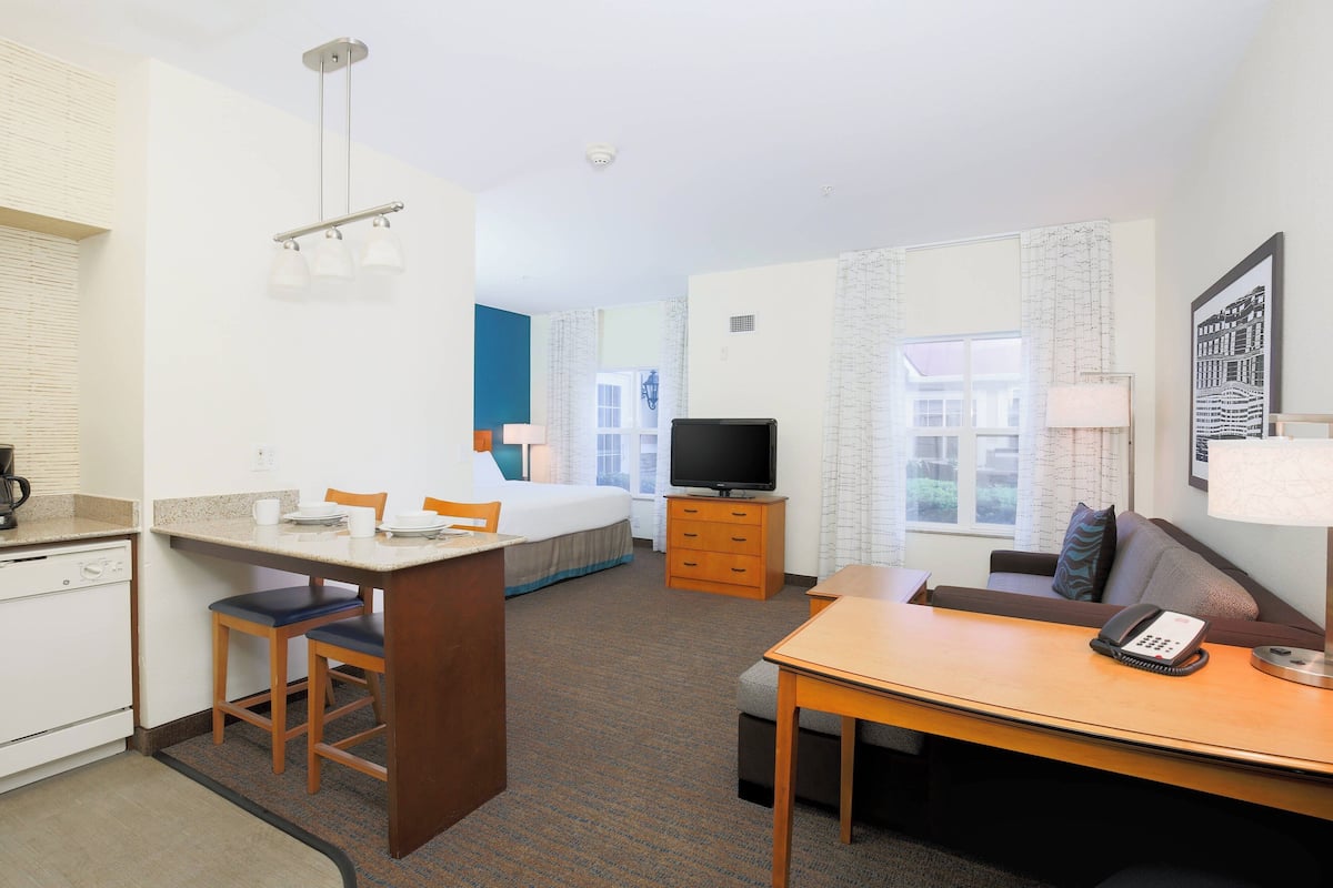 studio | desk, laptop workspace, blackout curtains, iron/ironing board