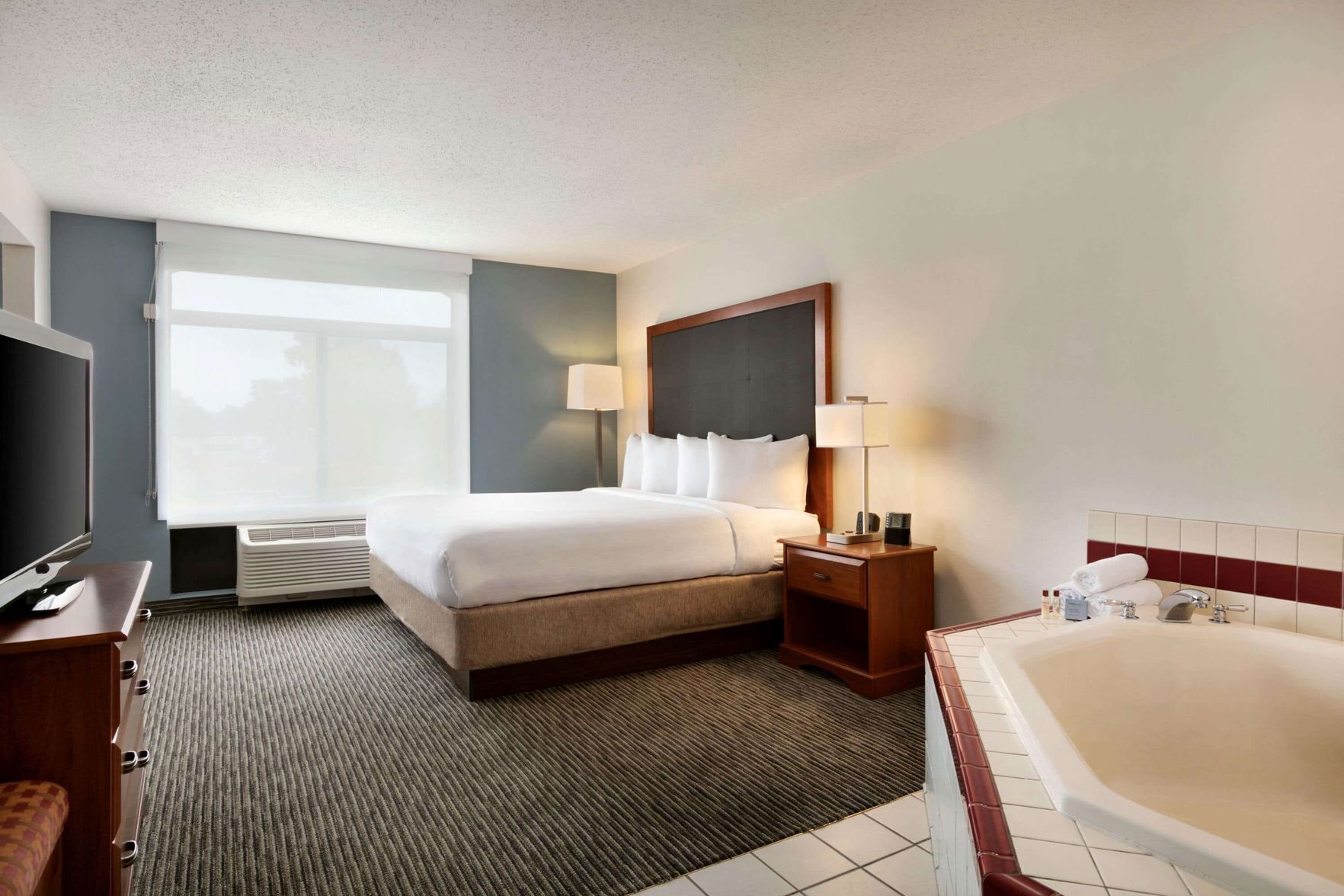 Down duvets, pillow-top beds, in-room safe, desk