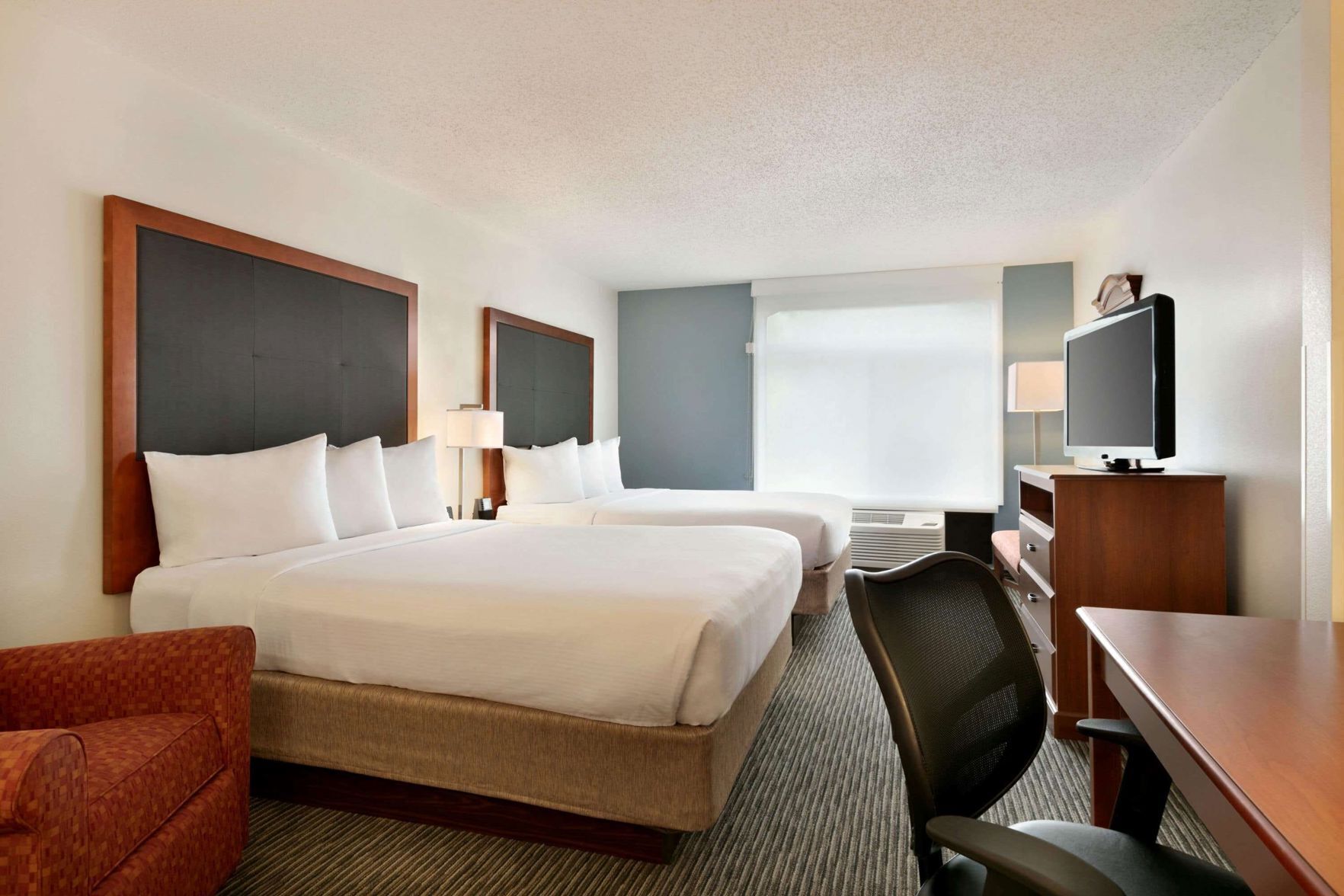 Down duvets, pillow-top beds, in-room safe, desk