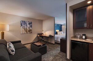 Suite, Multiple Beds | Living area | 43-inch Smart TV with satellite channels, TV, Netflix