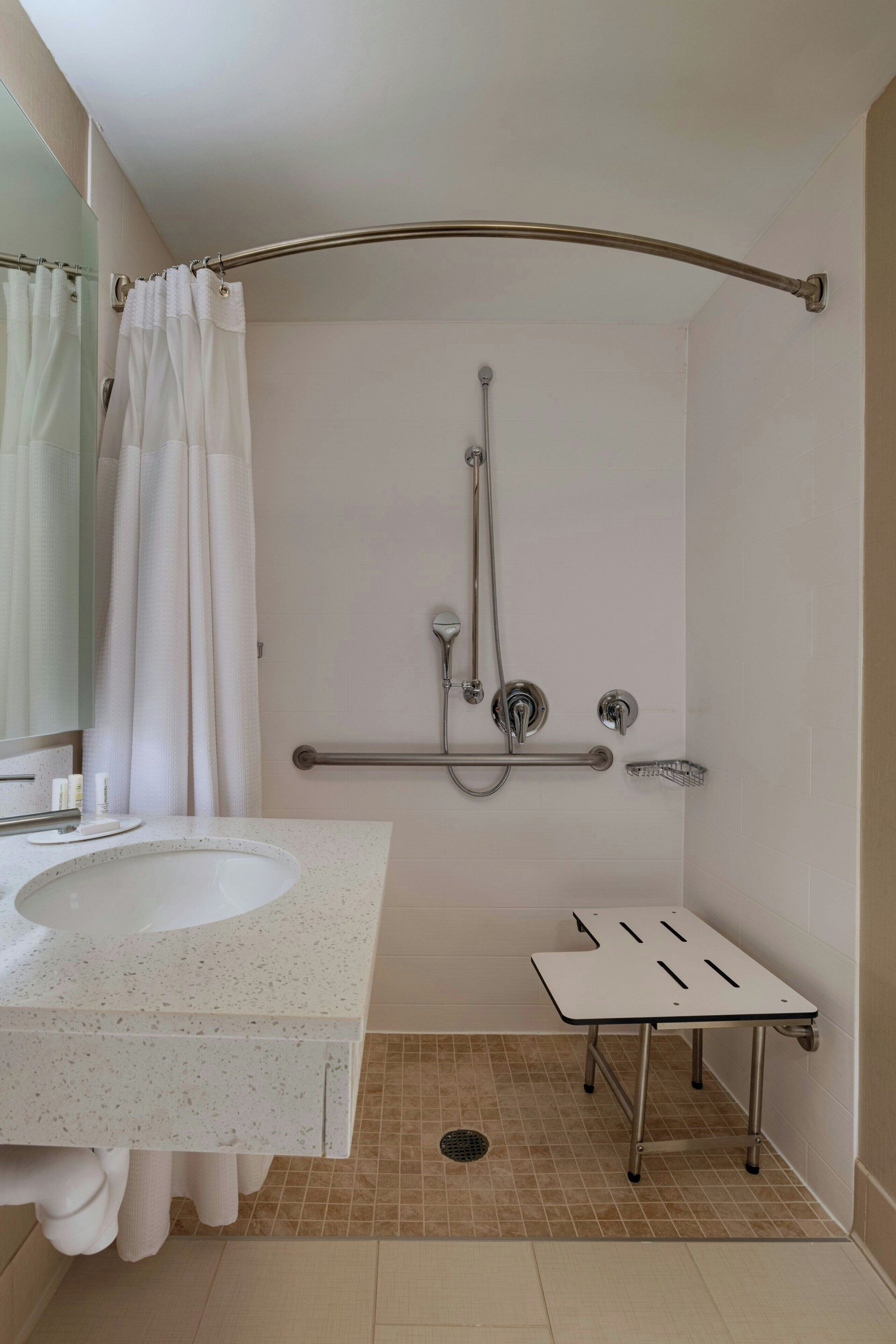 suite, multiple beds (mobility accessible, roll-in shower) | bathroom | free toiletries, hair dryer, towels, soap
