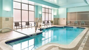 An indoor swimming pool with clear water, a shallow end marked '3 FT', and lounge chairs around the pool. - Springhill Suites by Marriott Pittsburgh North Shore (Pittsburgh)