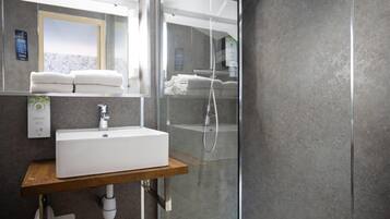 Combined shower/tub, eco-friendly toiletries, hair dryer, slippers