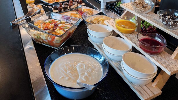 A buffet with various food items and condiments. - Sure Hotel by Best Western Rochefort-Sur-Mer (Tonnay-Charente)