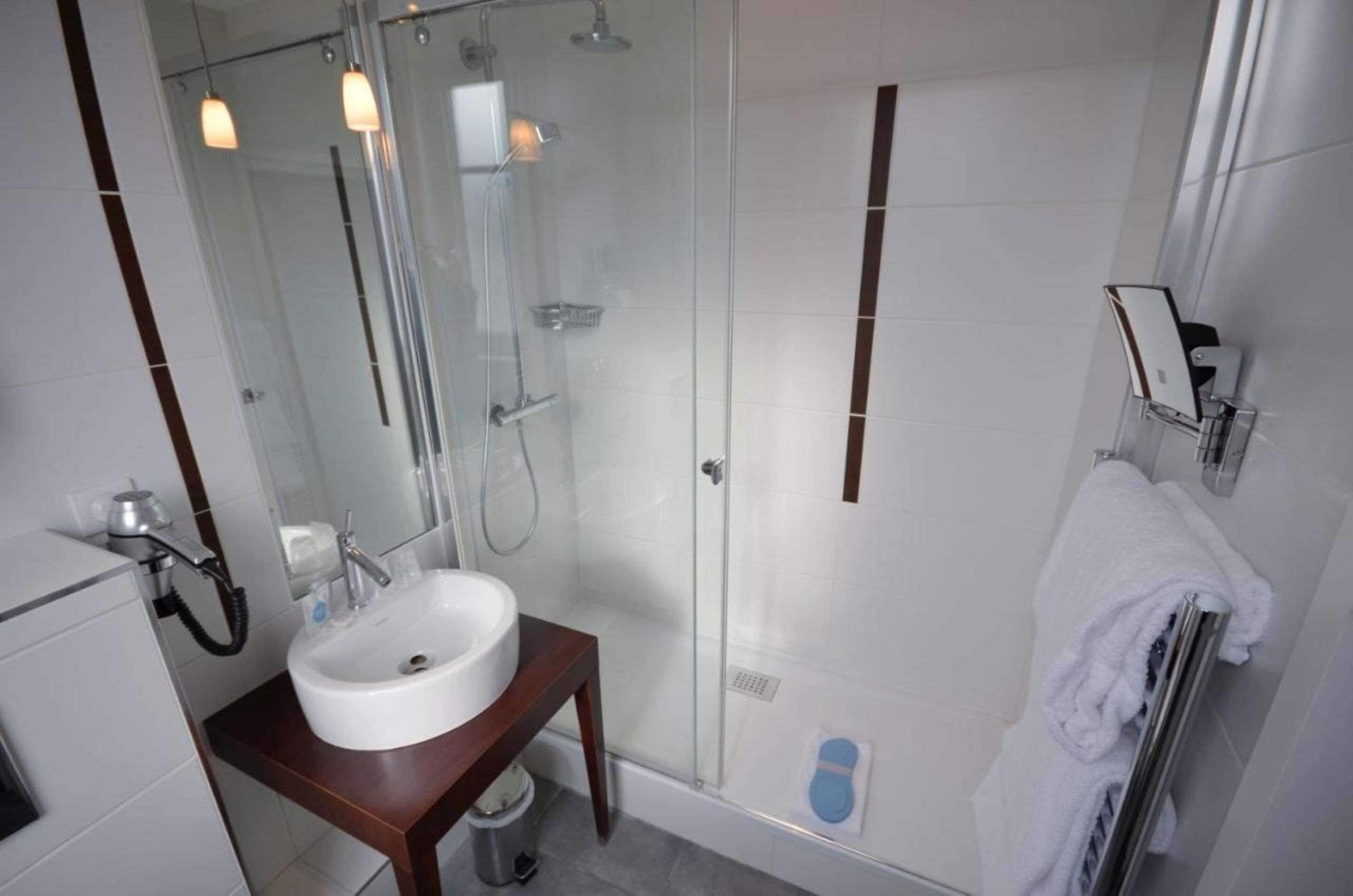 shower, eco-friendly toiletries, hair dryer, towels