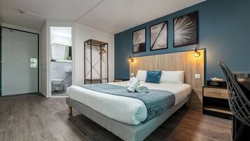 Premium bedding, desk, laptop workspace, free WiFi