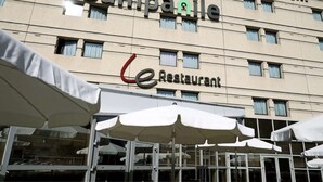 A hotel with a restaurant on the ground floor.