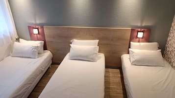 Room, 3 Single Beds | Desk, laptop workspace, blackout curtains, soundproofing