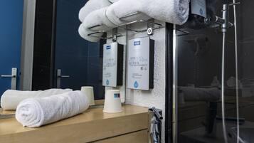 Shower, eco-friendly toiletries, hair dryer, towels