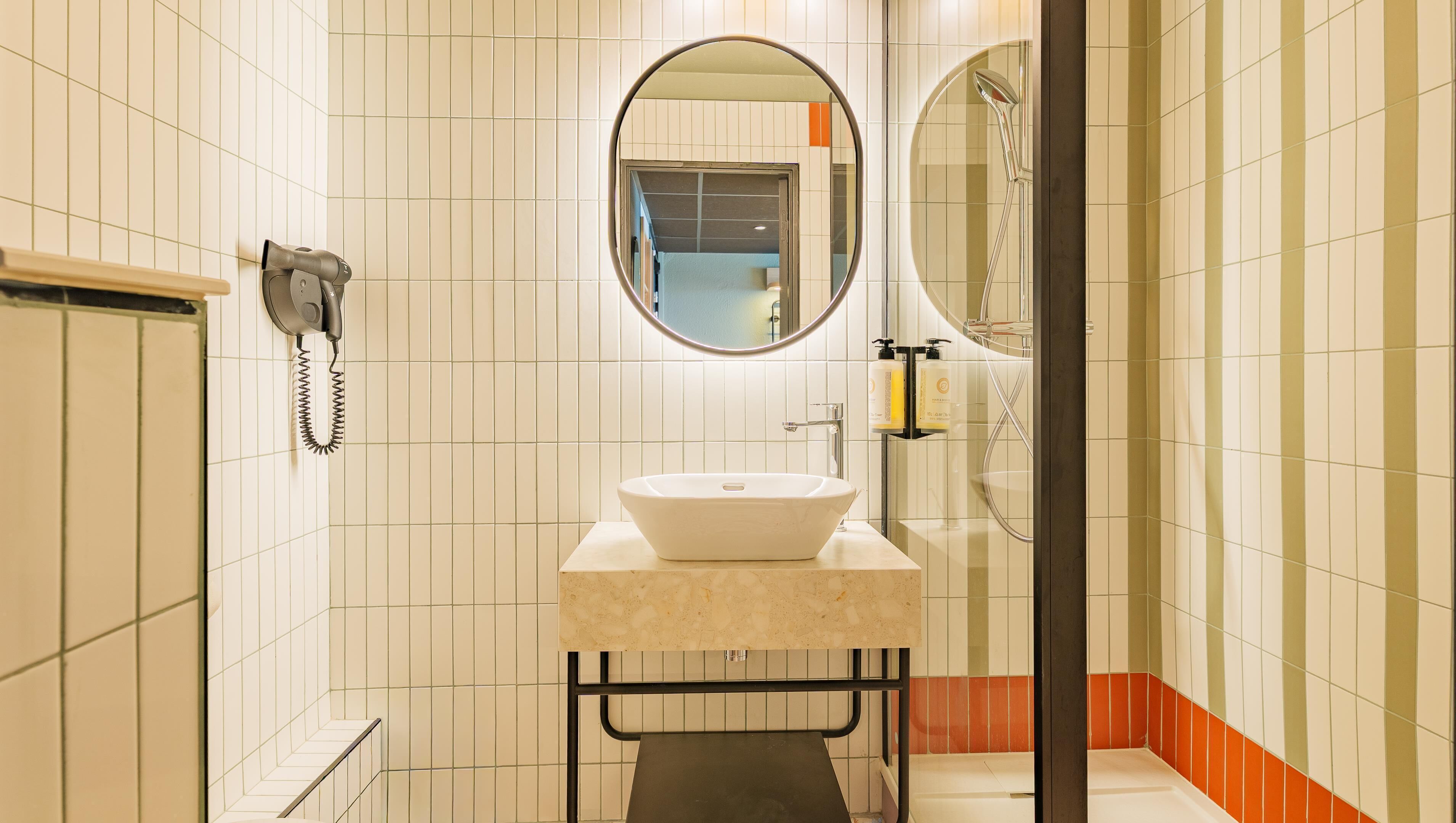 Bathtub, eco-friendly toiletries, hair dryer, towels