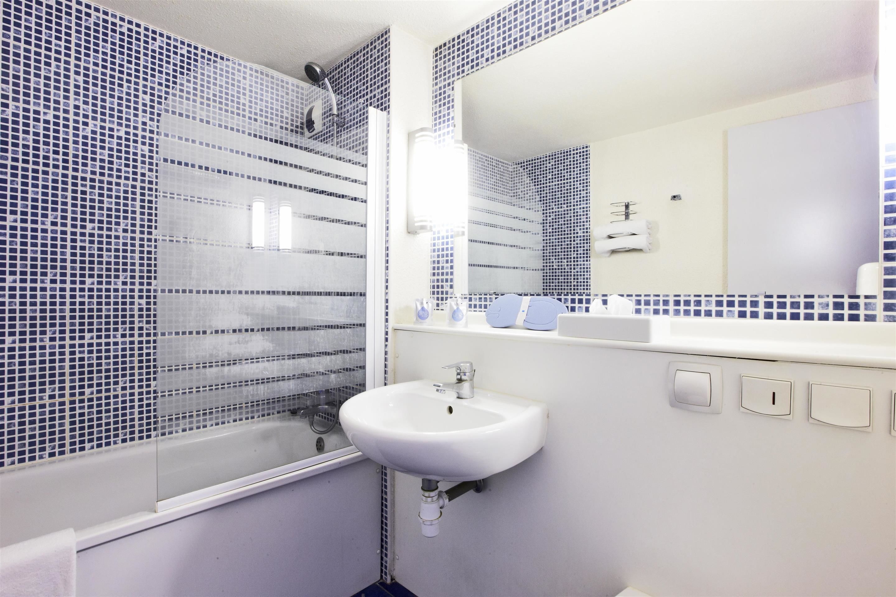 shower, eco-friendly toiletries, hair dryer, towels