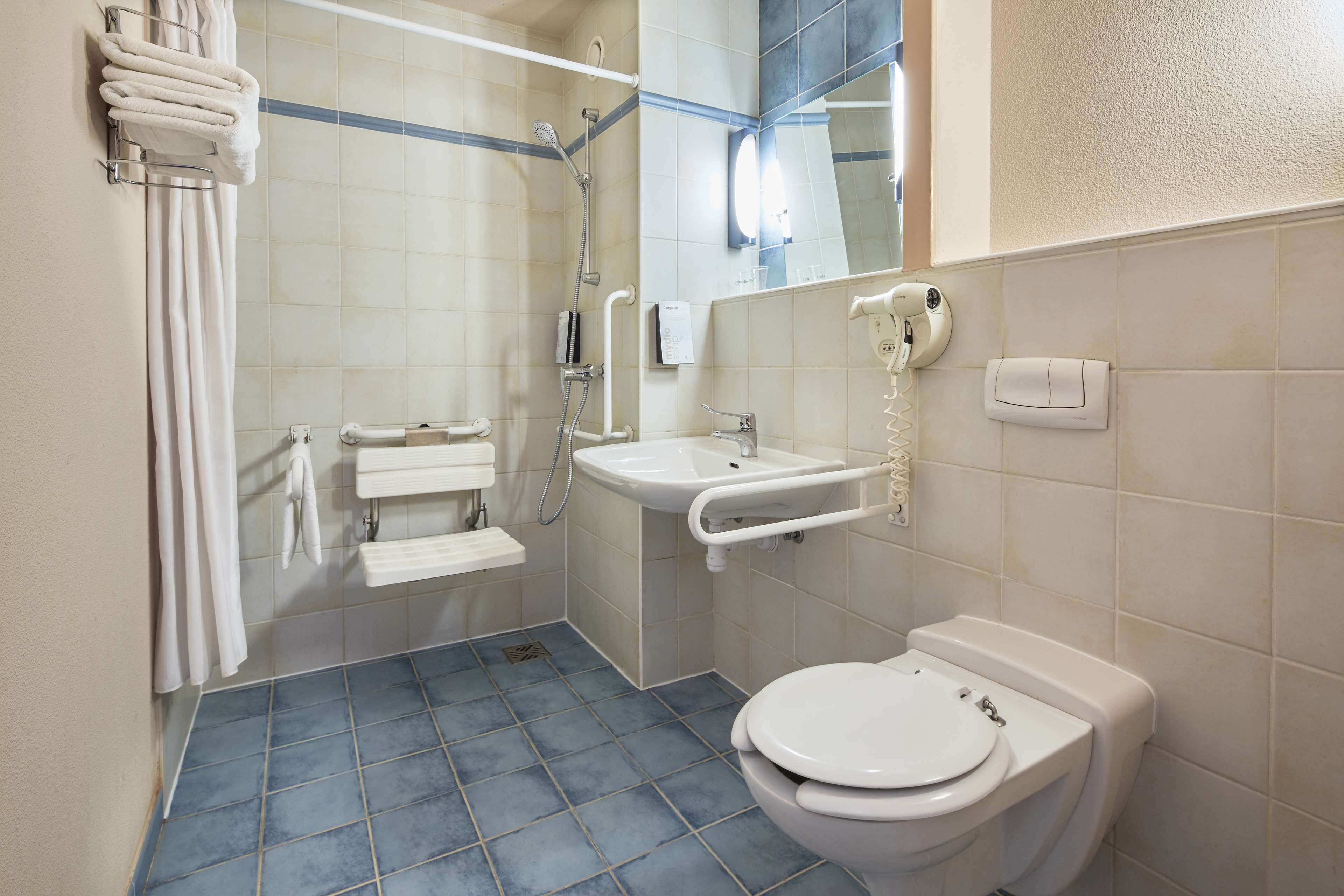 eco-friendly toiletries, hair dryer, towels