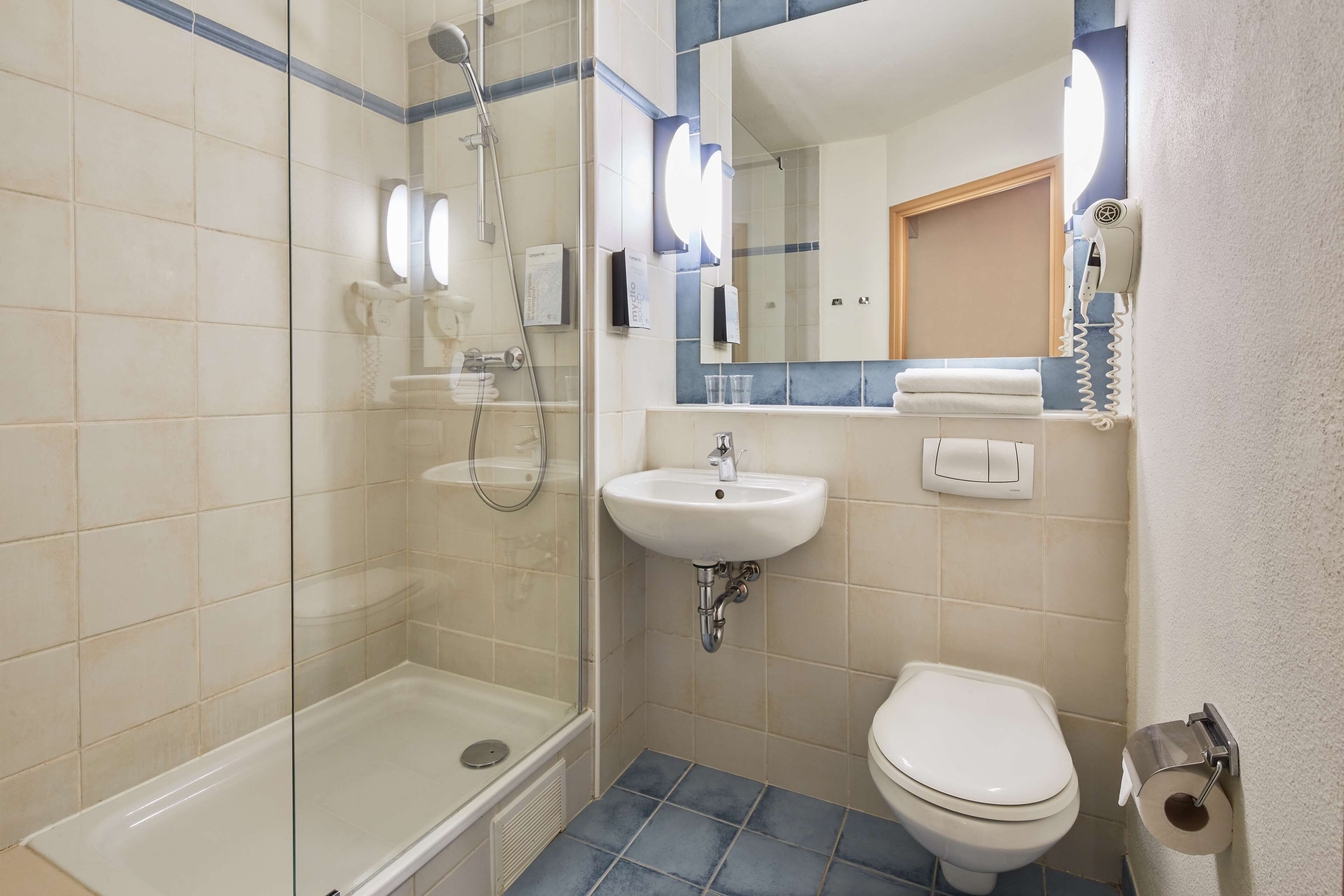 eco-friendly toiletries, hair dryer, towels