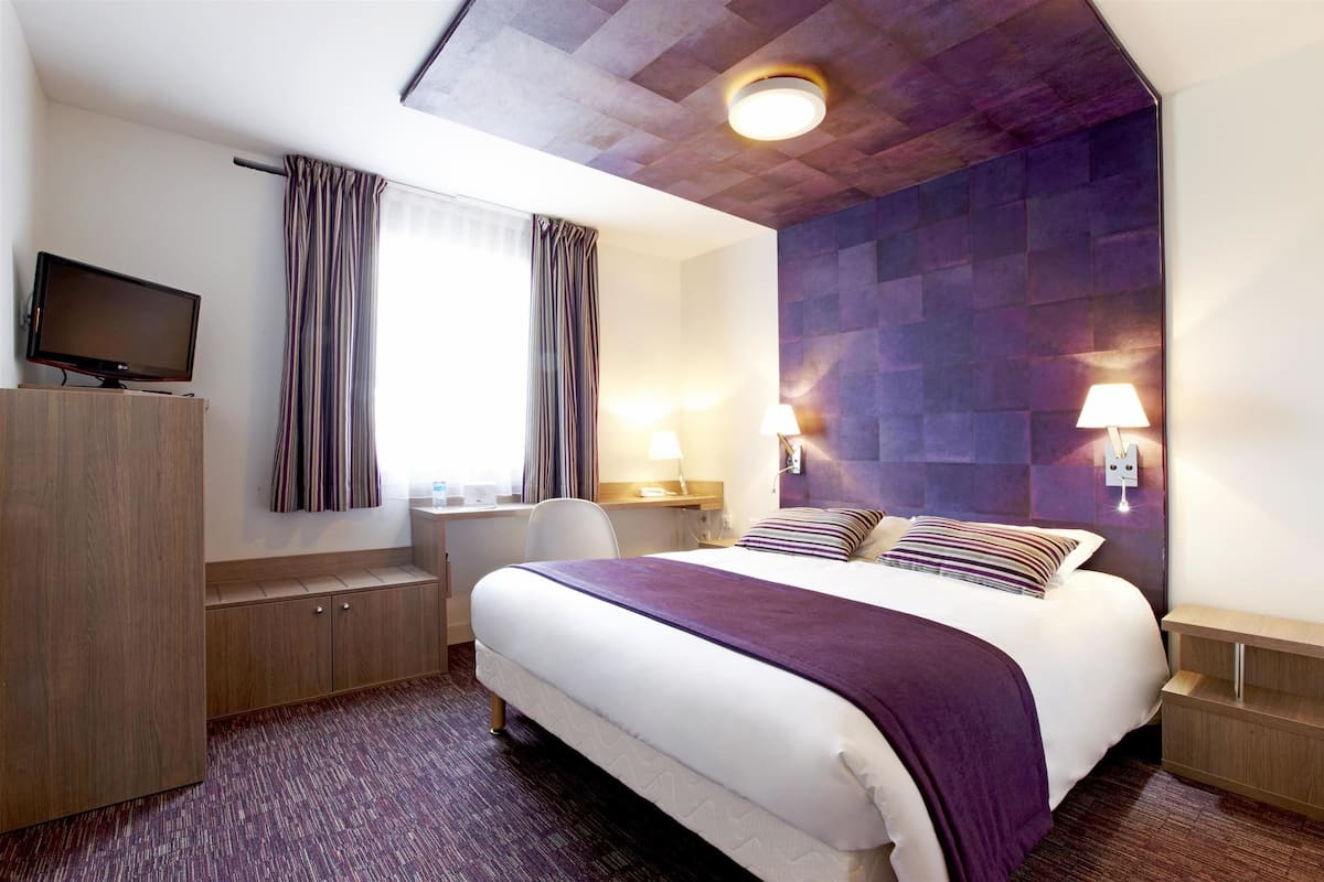 desk, laptop workspace, blackout curtains, iron/ironing board