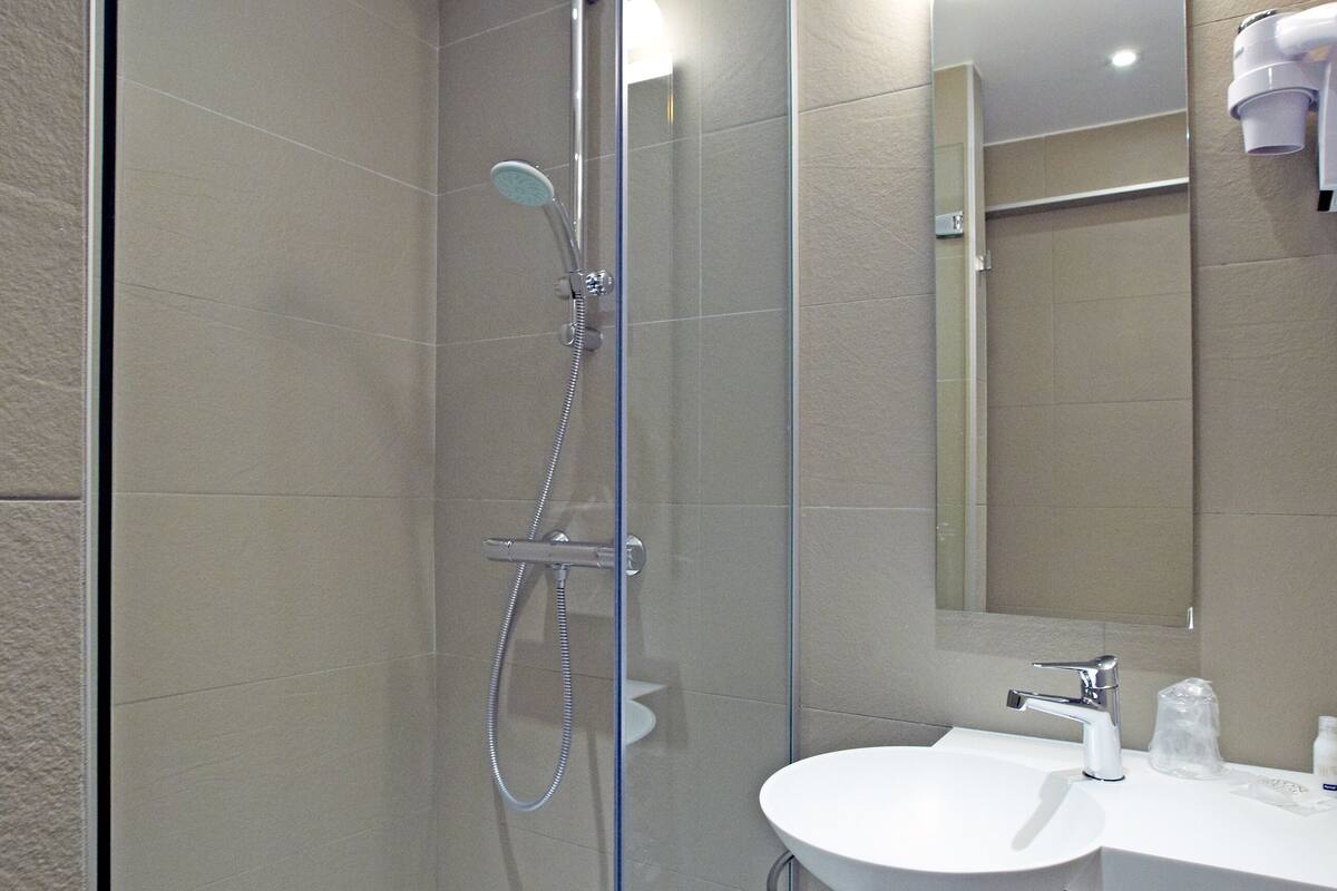 shower, eco-friendly toiletries, hair dryer, towels