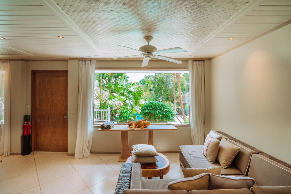 two bedroom pool villa | living area | 43-inch smart tv with satellite channels, tv, fireplace