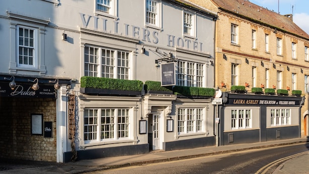 A building with the sign "Villiers Hotel" and a sign for "Laura Ashley The Tea Room" below it. - Villiers Hotel (Buckingham)