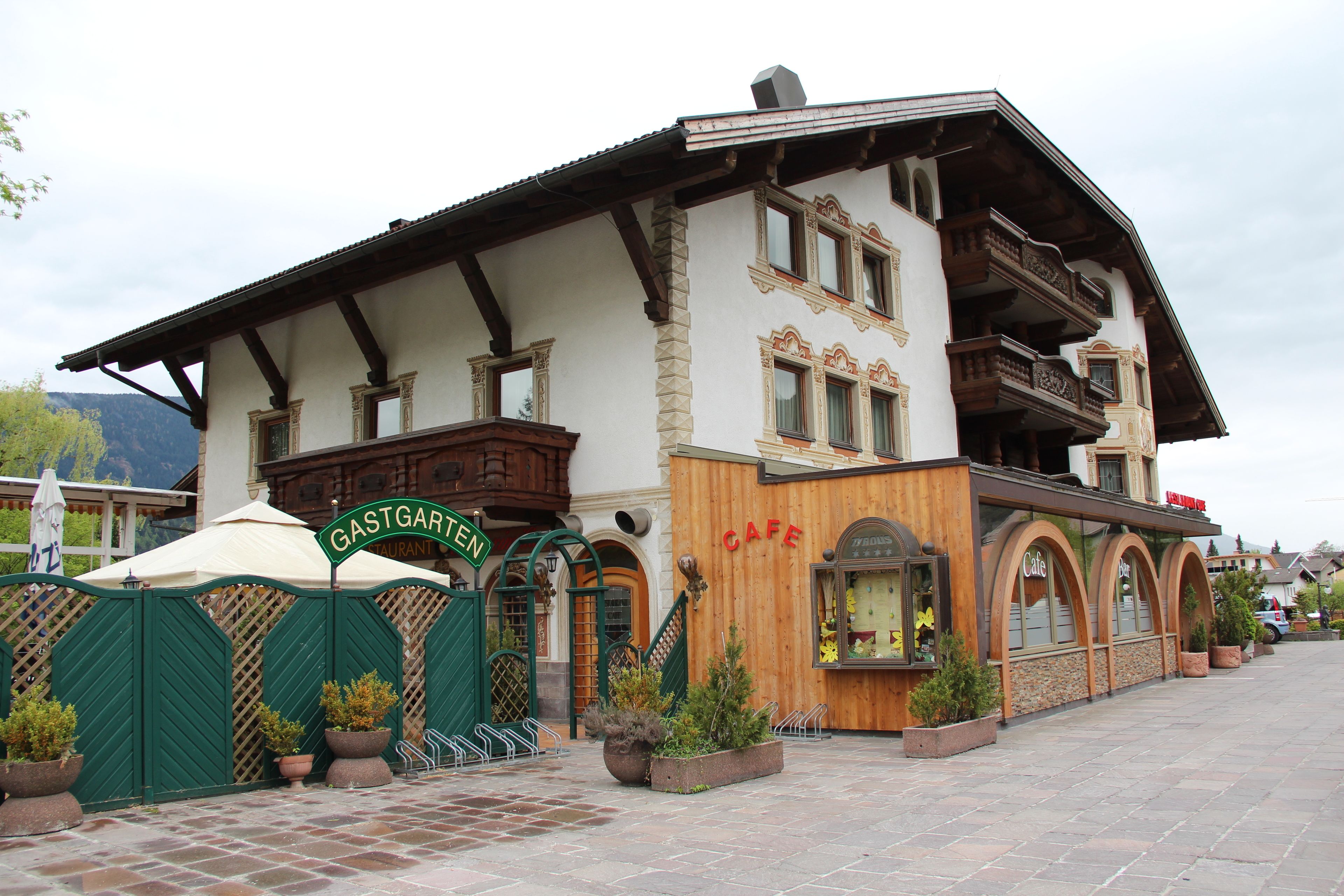 A traditional building with a sign reading "GASTGAUEN" and a wooden facade.