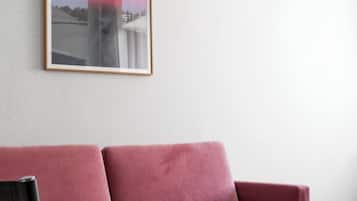 Classic Suite | Living area | 55-inch LED TV with satellite channels, TV