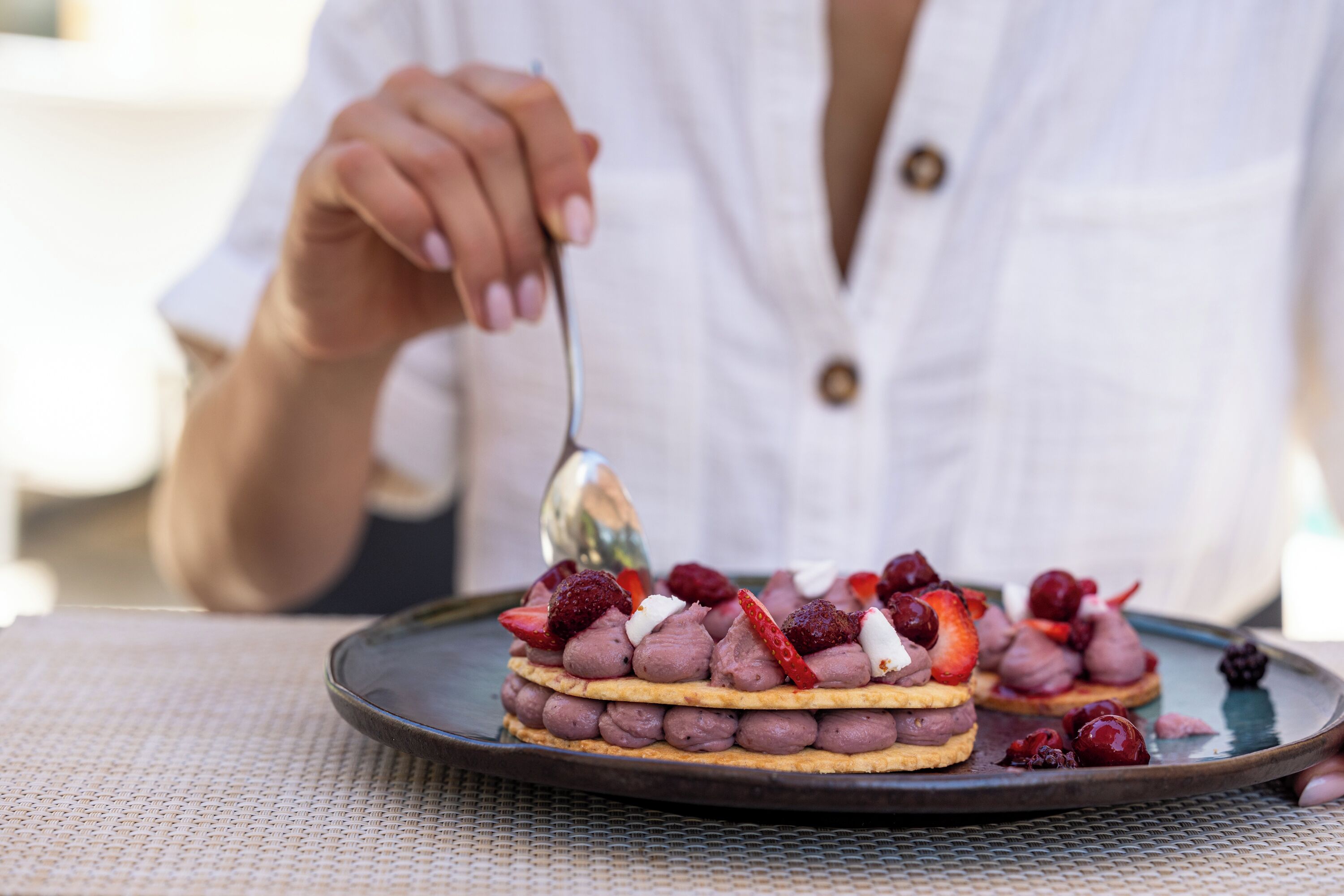 A dessert on a plate with a spoon.
