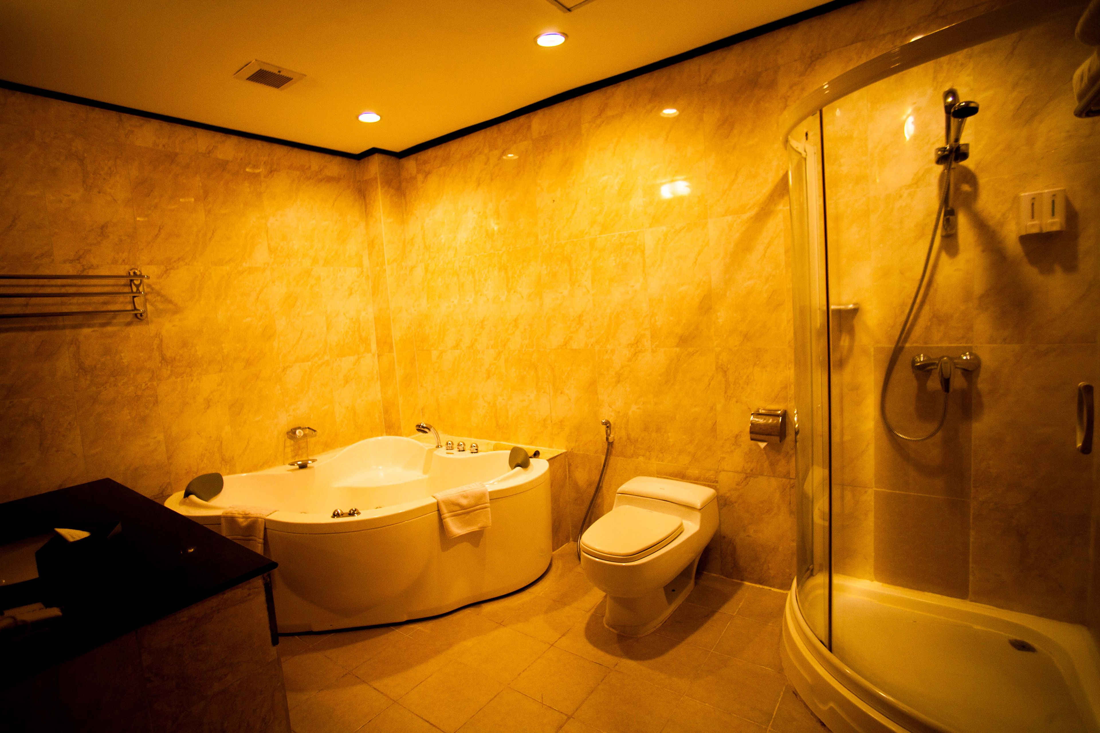 separate bathtub and shower, deep-soaking bathtub, designer toiletries