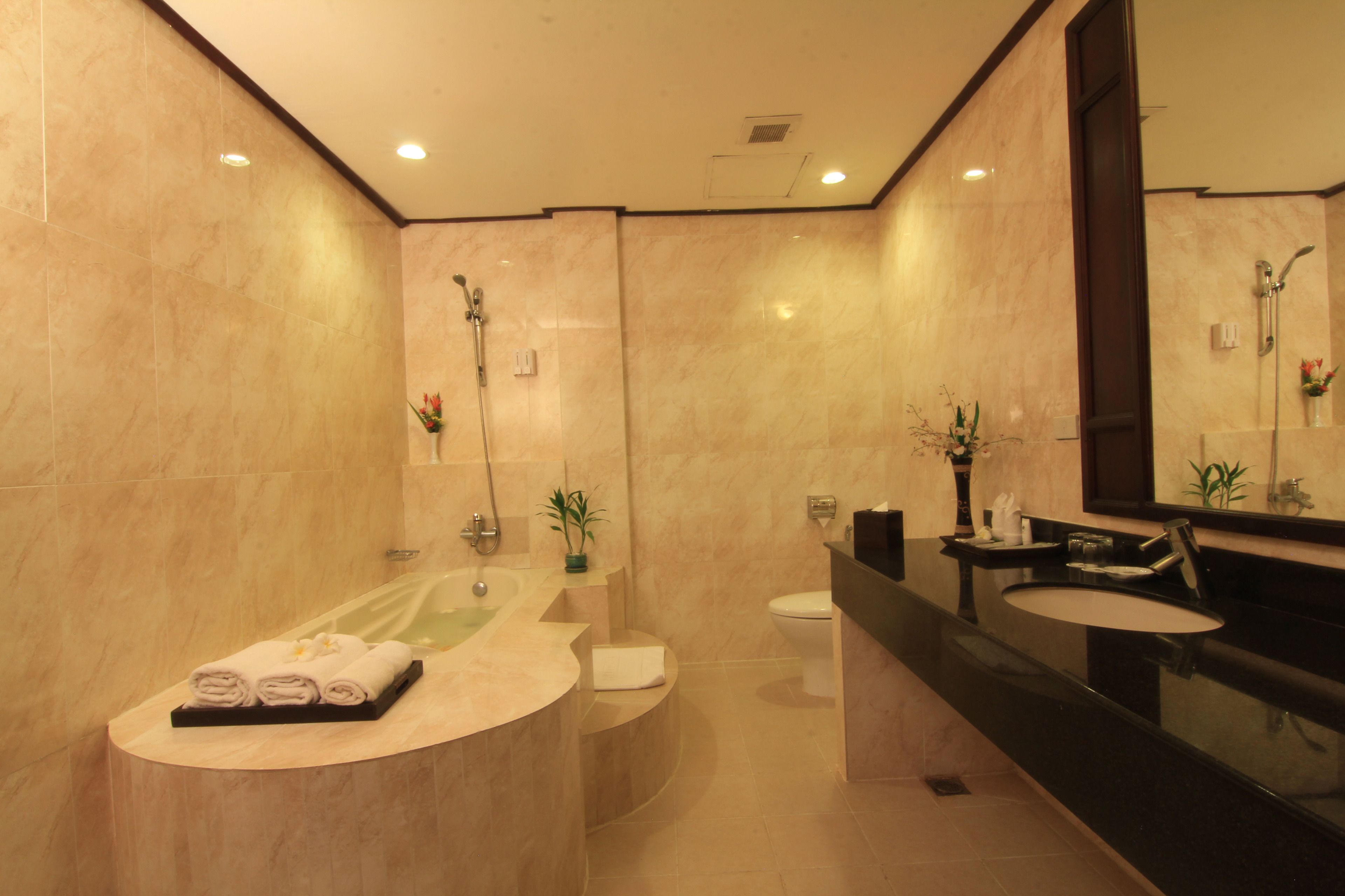 separate bathtub and shower, deep-soaking bathtub, designer toiletries