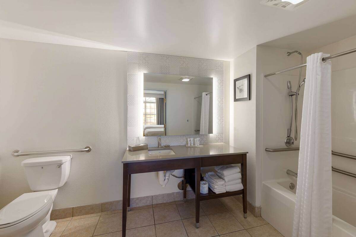 suite, 2 queen beds, non smoking | bathroom | combined shower/bathtub, free toiletries, hair dryer, towels