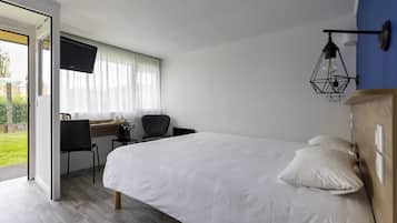 Desk, laptop workspace, iron/ironing board, free cribs/infant beds