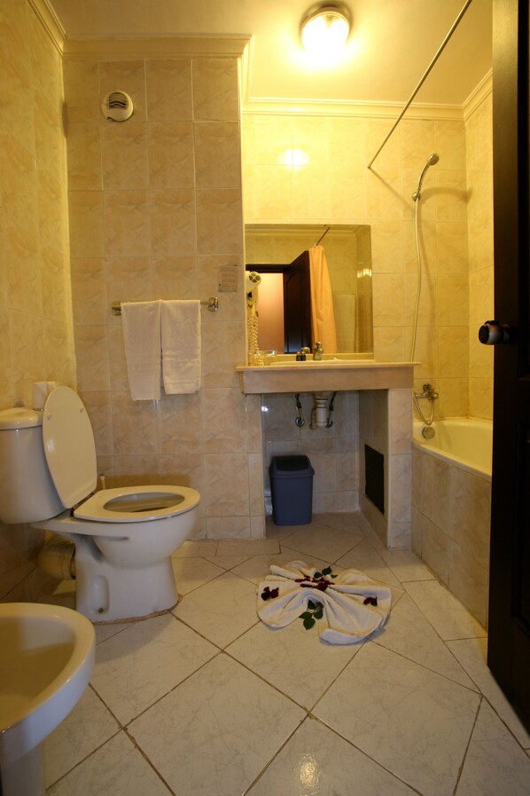 Quadruple Room, Pool View | Bathroom | Shower, hair dryer, towels