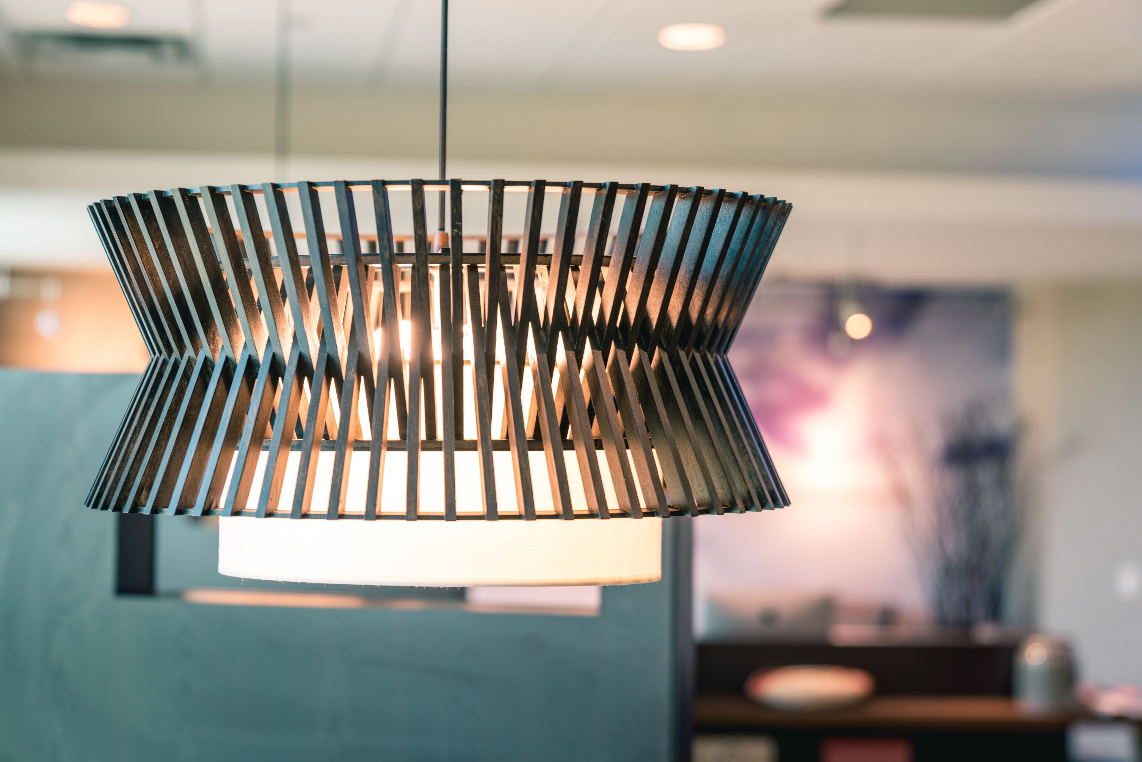 A modern pendant light fixture with a geometric design.