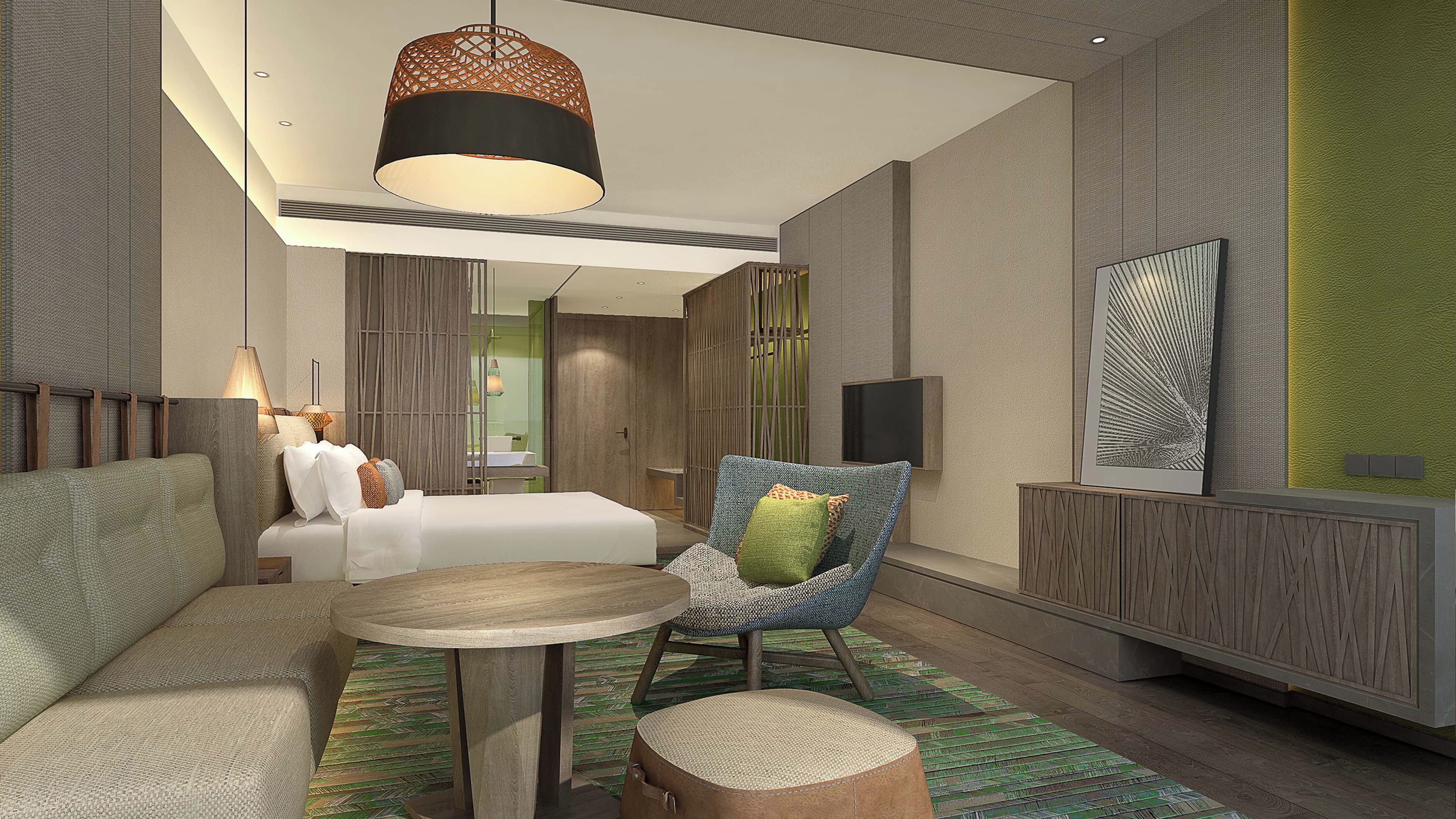 Una habitación de hotel moderna con cama, zona de estar y televisor.