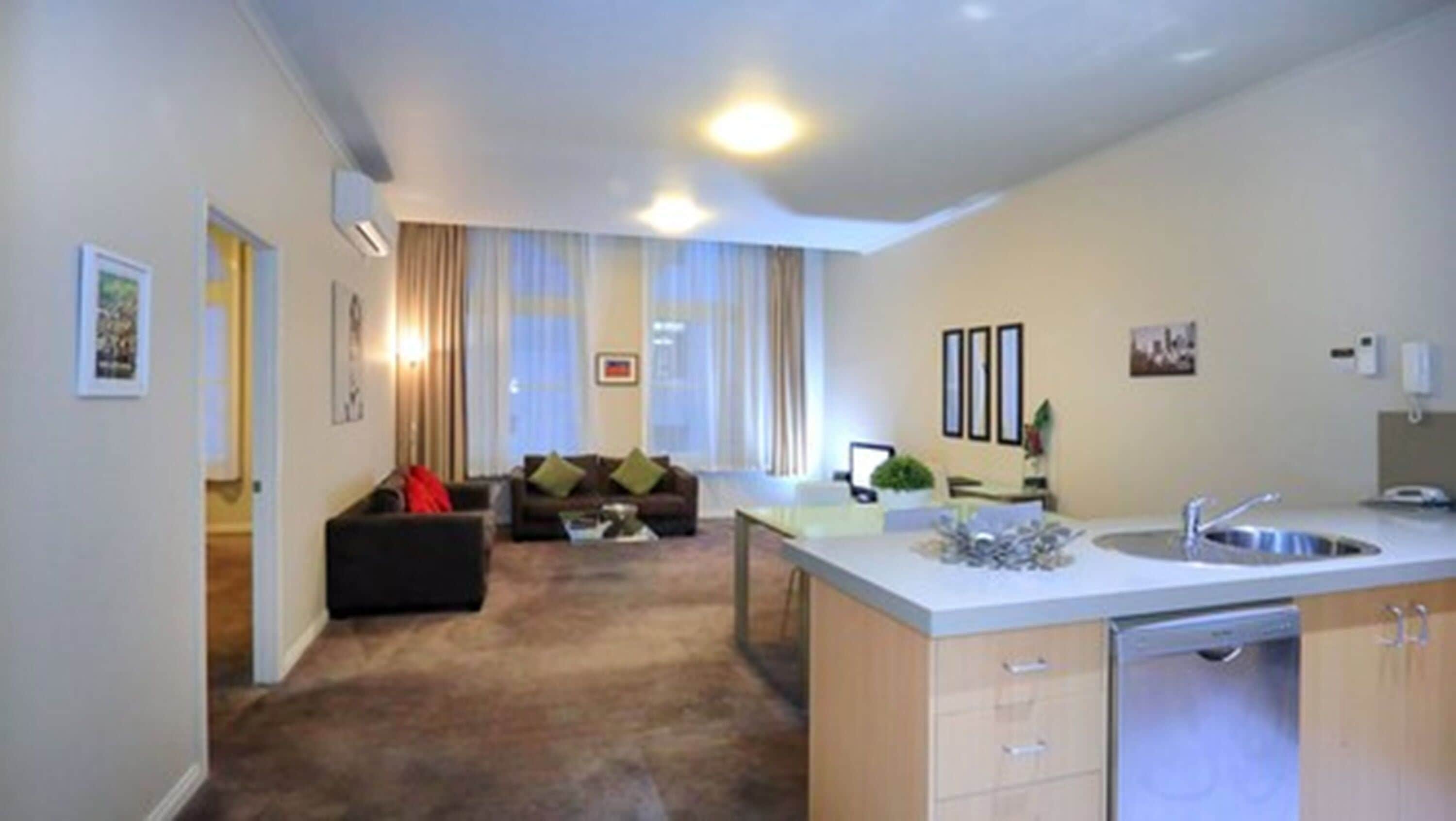 two bedroom two bathroom deluxe apartment | living area | lcd tv, dvd player
