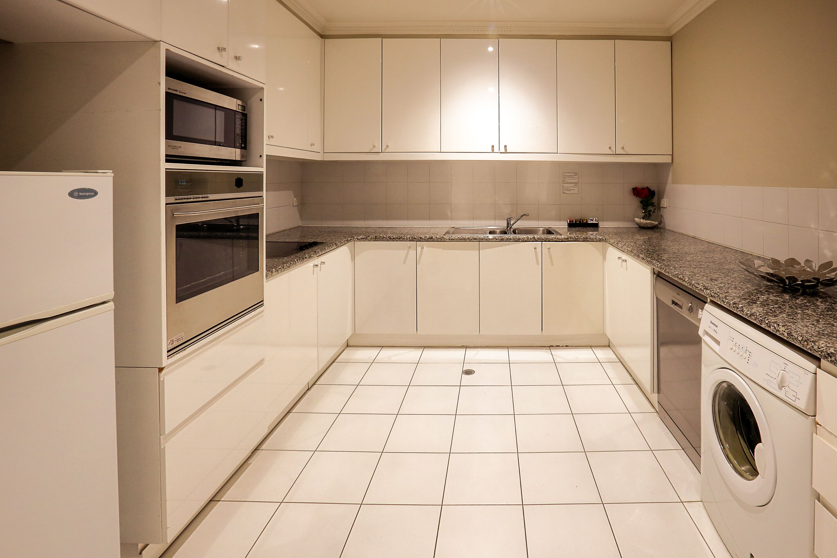 full-sized fridge, microwave, stovetop, dishwasher