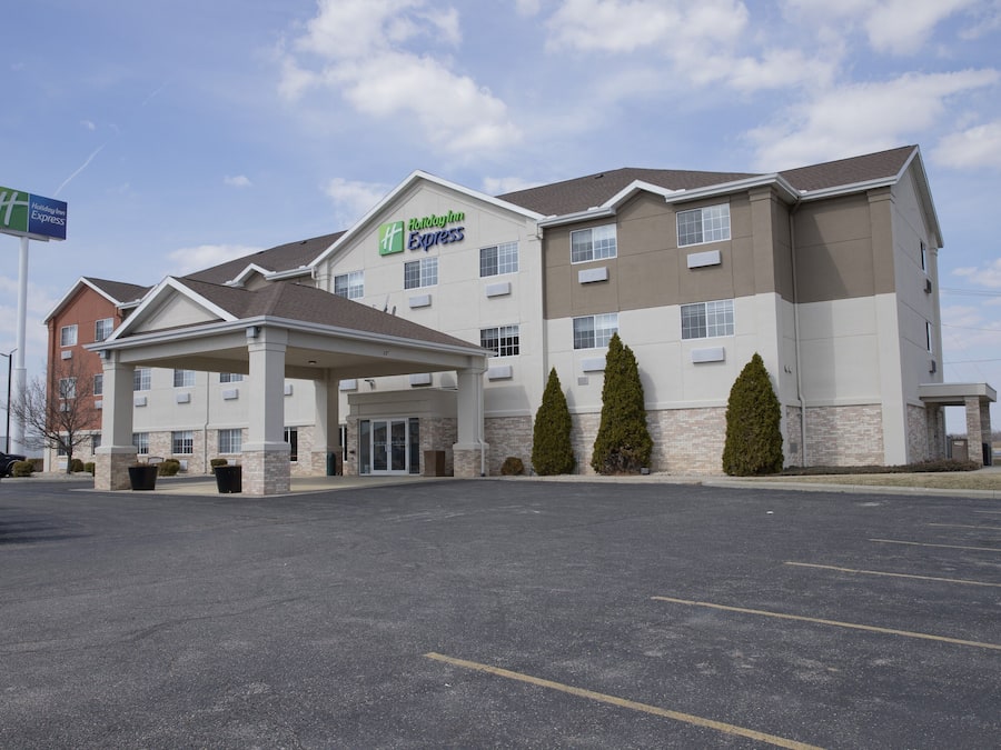 A Holiday Inn Express hotel with a covered entrance, multiple windows, and a parking lot.