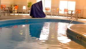 An indoor swimming pool with a covered chair, clear water, and a 4 FT depth marker. - Holiday Inn Express & Suites Maryville by IHG (Maryville)