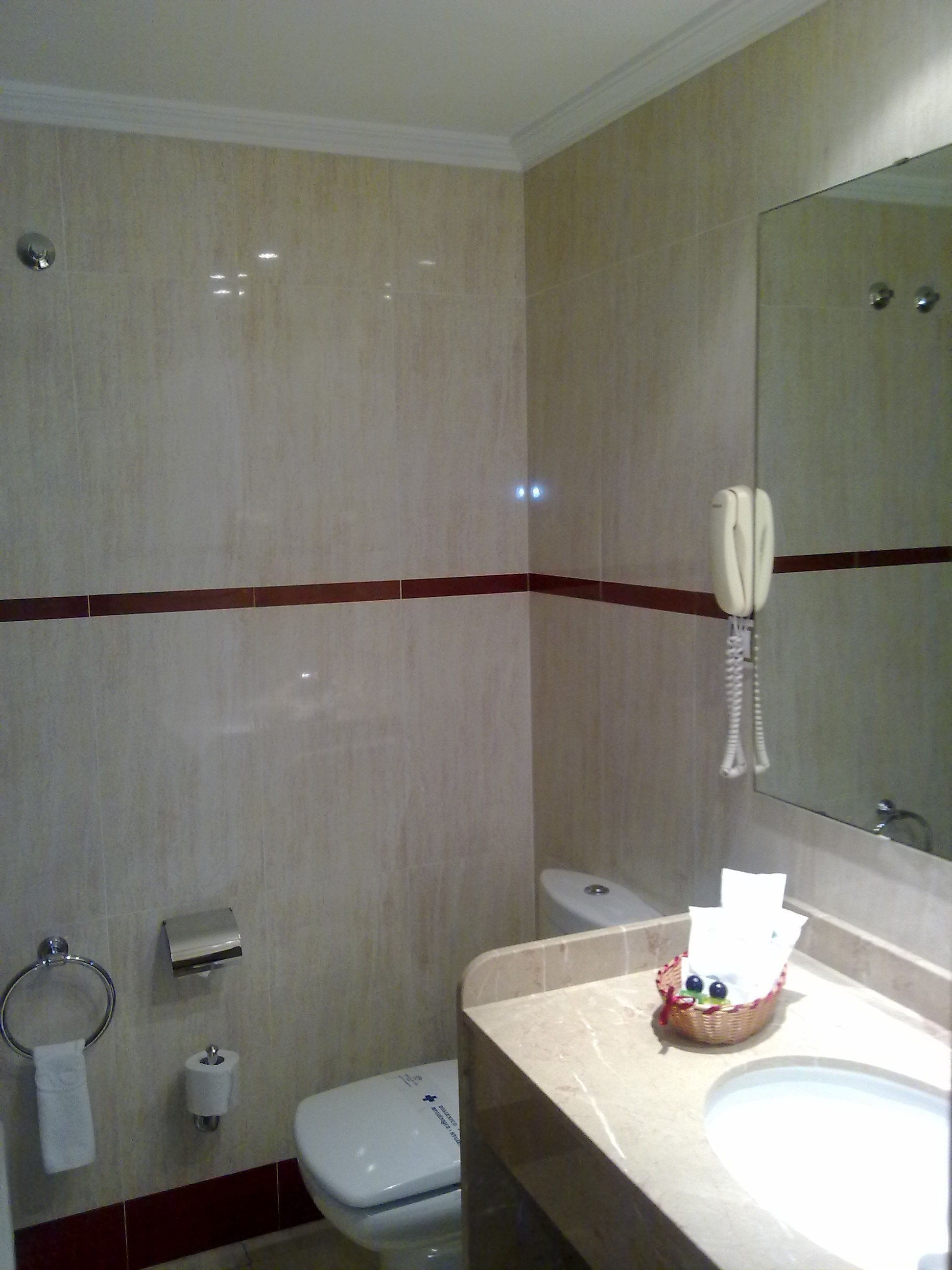 bathtub, free toiletries, hair dryer, towels