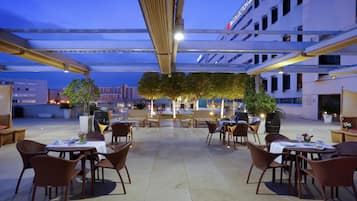 Lunch, dinner served; international cuisine, pool views