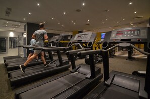 Work out in style with our state-of-the-art gym, featuring multiple treadmills with digital displays for a seamless fitness experience.