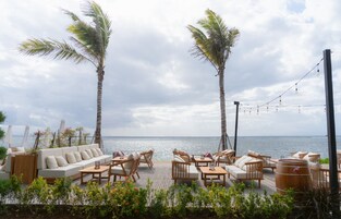 On the beach, white sand, sun loungers, beach umbrellas