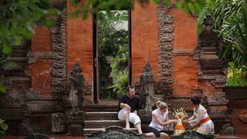 A temple entrance with intricate carvings and a statue.