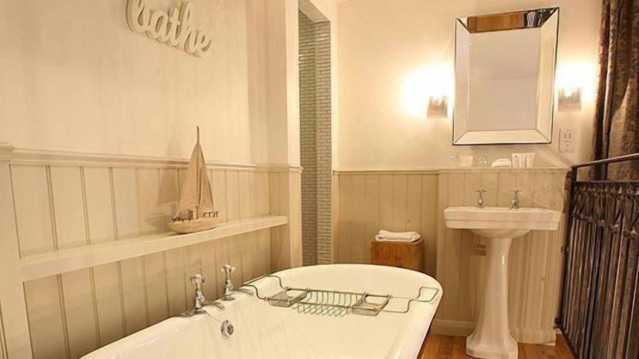 combined shower/bathtub, rainfall showerhead, designer toiletries