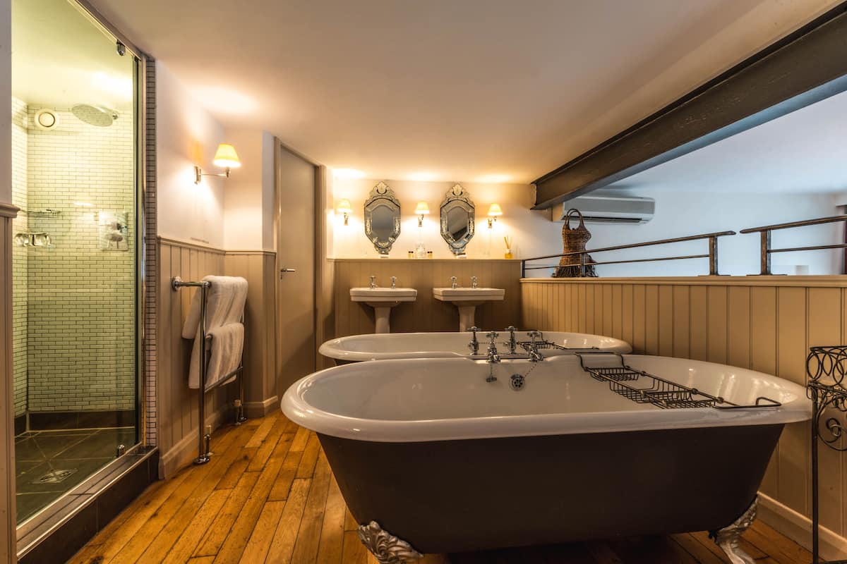 eclectic suite | premium bedding, minibar, individually decorated, individually furnished