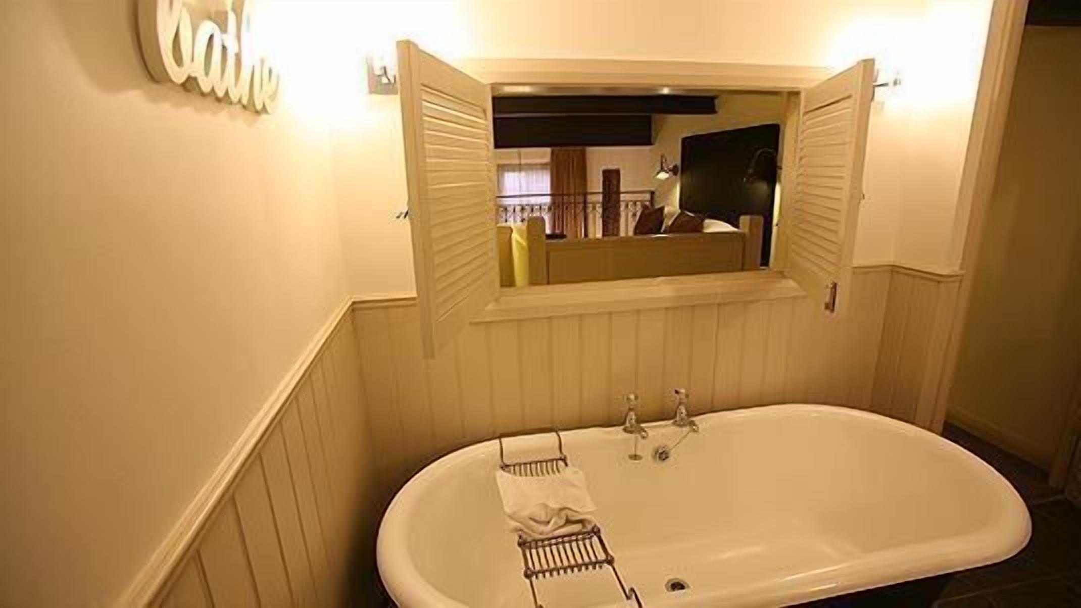 combined shower/bathtub, rainfall showerhead, designer toiletries